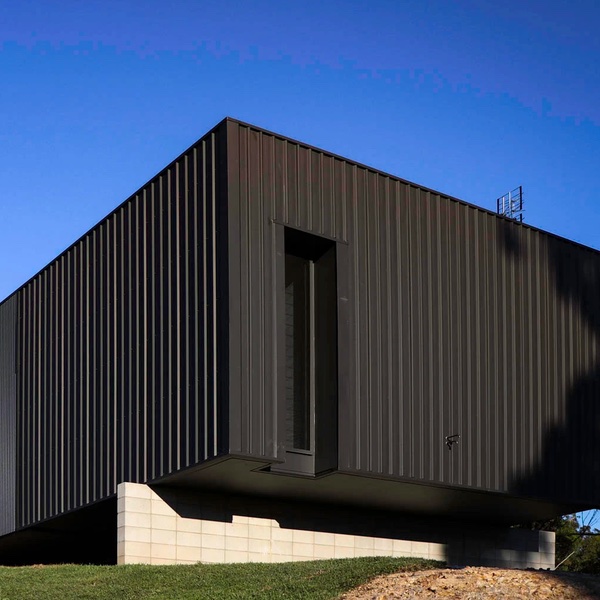This image shows a modern black looking home in a matt colorbond.